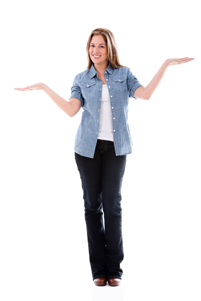 Woman with arms open balancing things - isolated over white